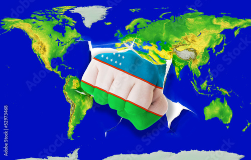 Photo: Fist in color national flag of uzbekistan punching world map Fist in color national flag of uzbekistan punching world map