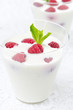 panna cotta with fresh raspberries in glasses closeup
