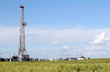 field with oil drilling rig