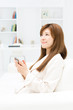 Foto: Beautiful young businesswoman using a cellular Beautiful young businesswoman using a cellular