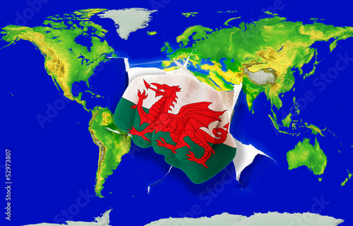 Photo: Fist in color national flag of wales punching world map Fist in color national flag of wales punching world map