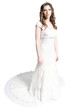 Standing bride in white dress with train isolated on white