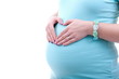 Pregnant woman making heart shape