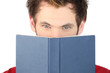 Man covering his face with the bible