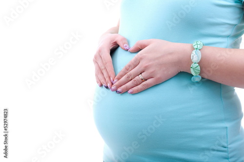 Photo: Pregnant woman making heart shape Pregnant woman making heart shape