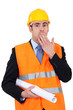 construction businessman putting a hand on his mouth