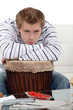 Photo: Man with his arms on his drum Man with his arms on his drum