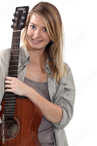 Photo: Woman playing guitar Woman playing guitar