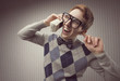 Nerd student with an old mobile phone