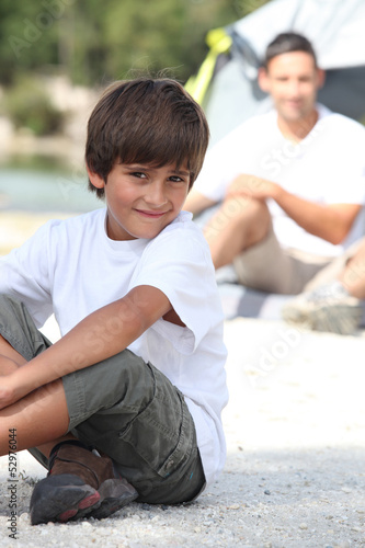 Photo: Boy and his Dad camping Boy and his Dad camping