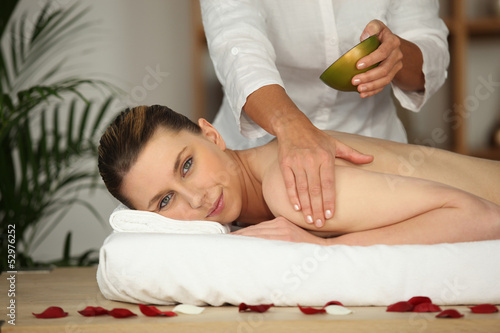 Photo: Woman receiving massage Woman receiving massage