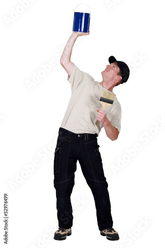 Photo: Decorator lifting his paint can Decorator lifting his paint can
