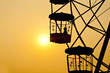 Little girl in ferris wheel silhouette.