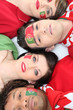 Foto: Four Portuguese soccer fans laying down together Four Portuguese soccer fans laying down together