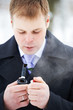 man smokes pipe