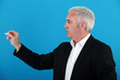 Photo: A businessman holding a chalk. A businessman holding a chalk.