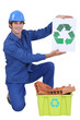 Photo: Builder holding recycle sign Builder holding recycle sign