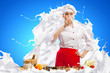 Asian female cook against milk splashes