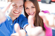 Smiling Couple With Thumbs Up