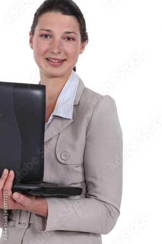 Photo: Woman carrying her laptop Woman carrying her laptop