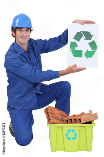 Photo: Builder holding recycle sign Builder holding recycle sign