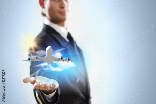Photo: Image of pilot with plane in hand Image of pilot with plane in hand