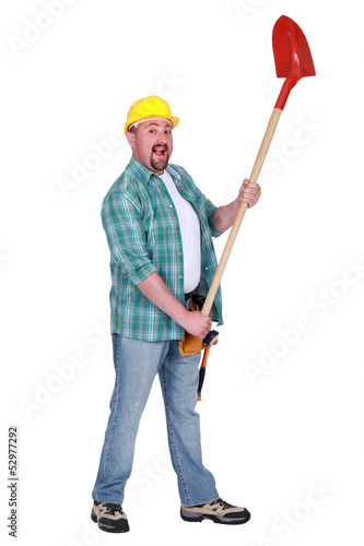Photo: Happy man holding shovel Happy man holding shovel