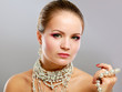 Portrait of pretty young woman with beads