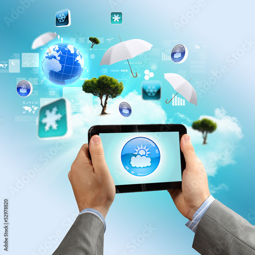 Photo: Close-up of hands holding tablet pc Close-up of hands holding tablet pc