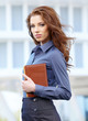 Photo: Young happy women or student on the property business background Young happy women or student on the property business background