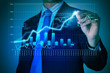 Business man drawing graphics