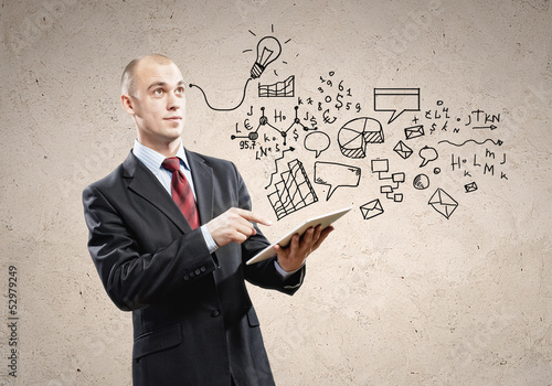 Photo: Businessman with ipad in hands Businessman with ipad in hands
