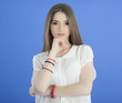 Young Woman with long Hair on blue background