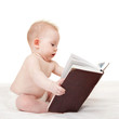 Foto: Cute baby with book on the white background Cute baby with book on the white background