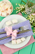 Table setting in violet and pink tones
