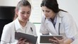 Two female doctors with tablet computers