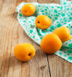 Apricots on the wooden table.