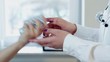 Doctor hand offering pills, close up