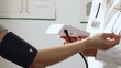 Female doctor measure blood pressure, close up
