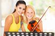 Photo: music teacher with young student music teacher with young student