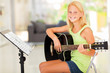 preteen girl practicing guitar