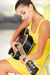 beautiful woman playing guitar