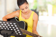 beautiful woman playing guitar