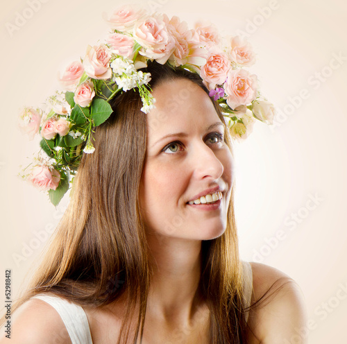 Photo: Beautiful woman with flowers in their hair Beautiful woman with flowers in their hair