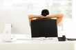 Photo: rear view of businesswoman relaxing in office rear view of businesswoman relaxing in office