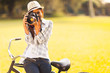 young woman taking photo outdoors