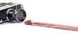 Old camera and film strip isolated