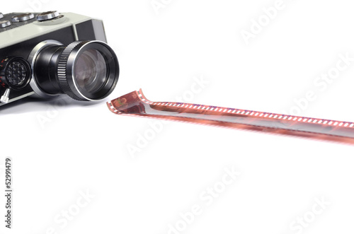 Photo: Old camera and film strip isolated Old camera and film strip isolated