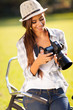 beautiful woman reviewing photos on camera