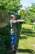 Photo: boy shooting a bow boy shooting a bow